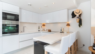 Resa Estates apartment for sale in Ibiza marina botafoch modern kitchen and bar.jpg